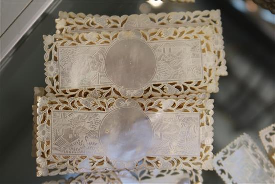 A part set of 56 19th century Chinese mother of pearl gaming counters, in four sizes, Largest 2.75in.